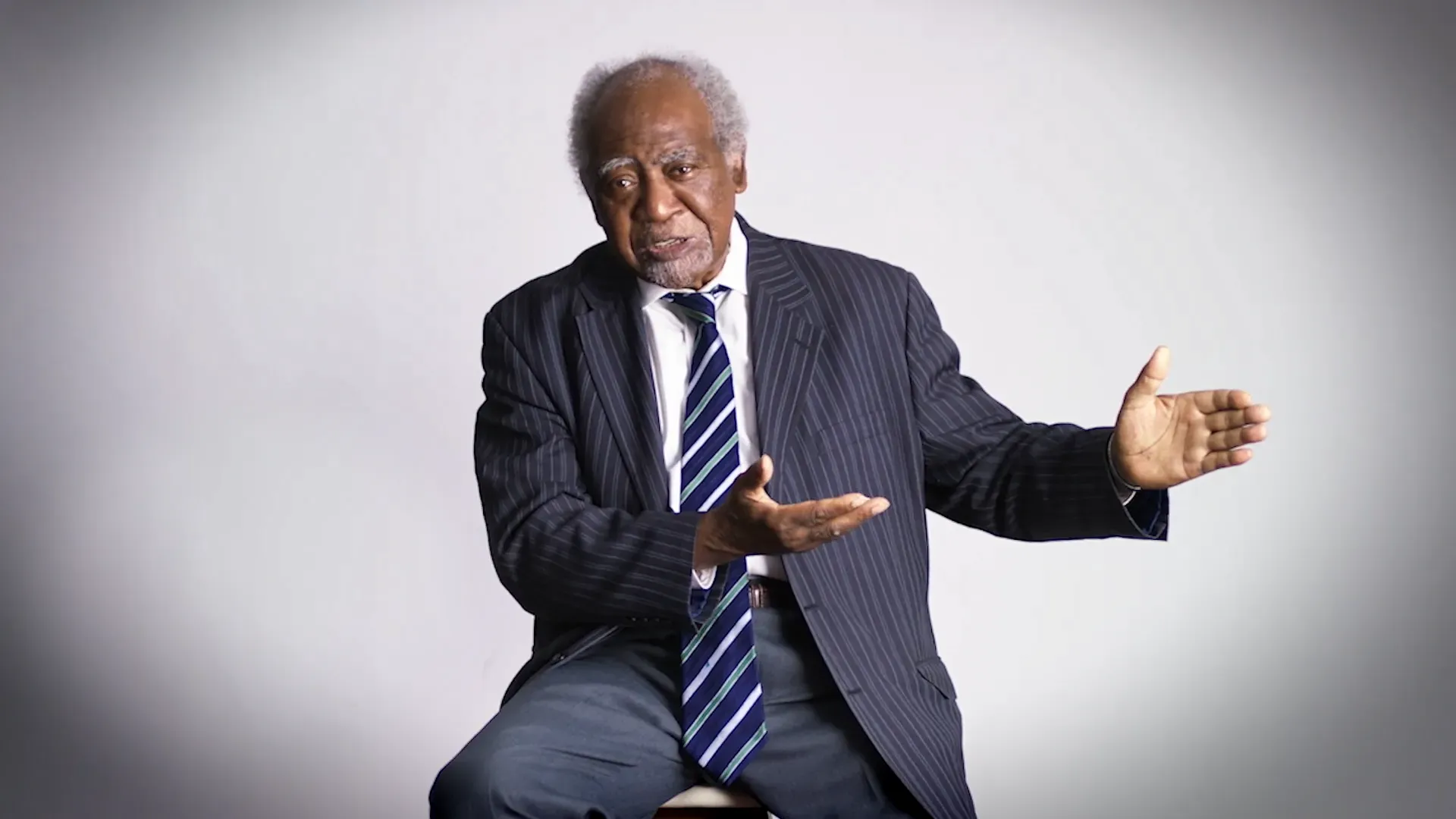 Danny Davis seated against a white background.